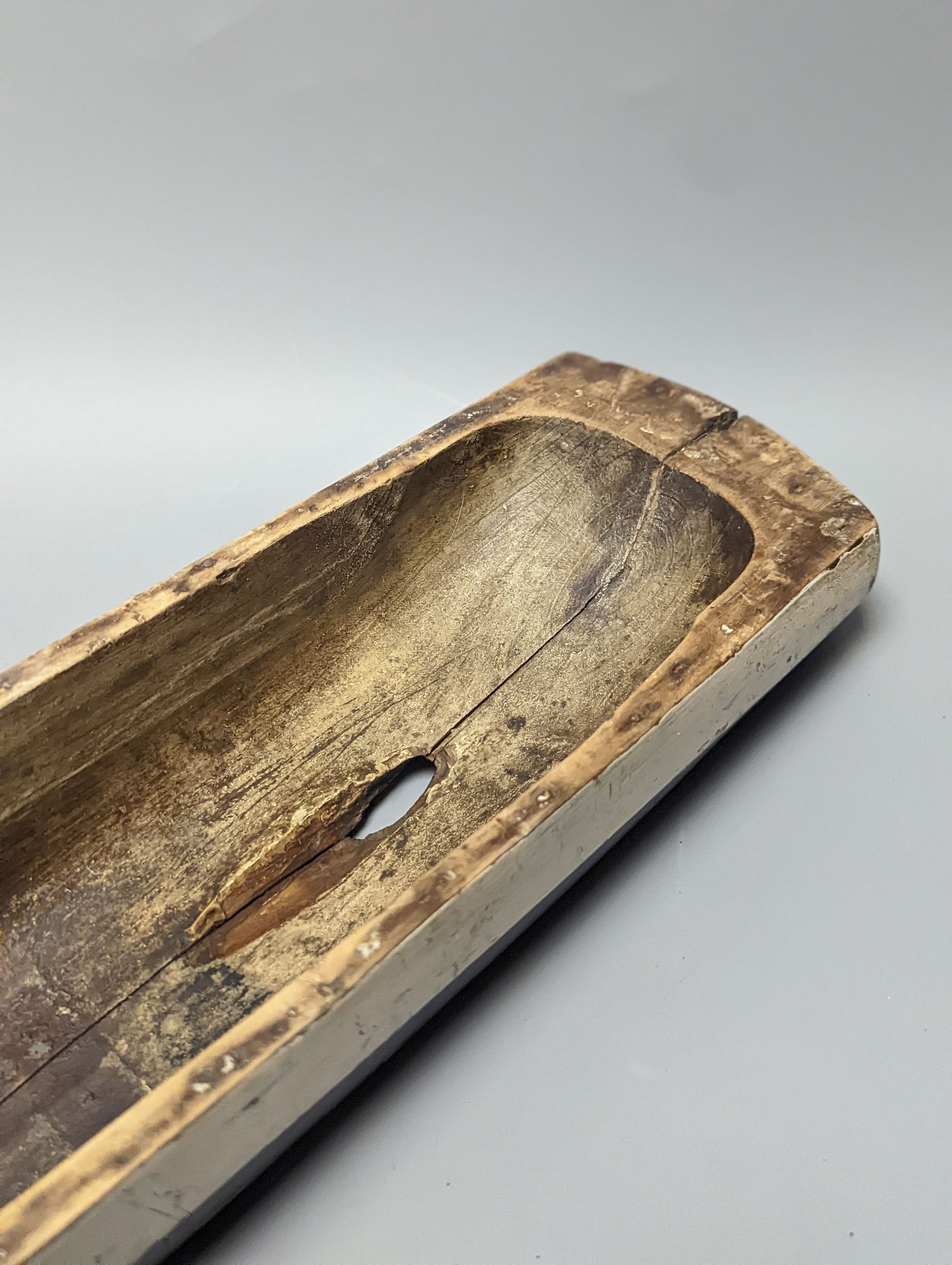 A 19th century painted wood model of a boat hull 60cm